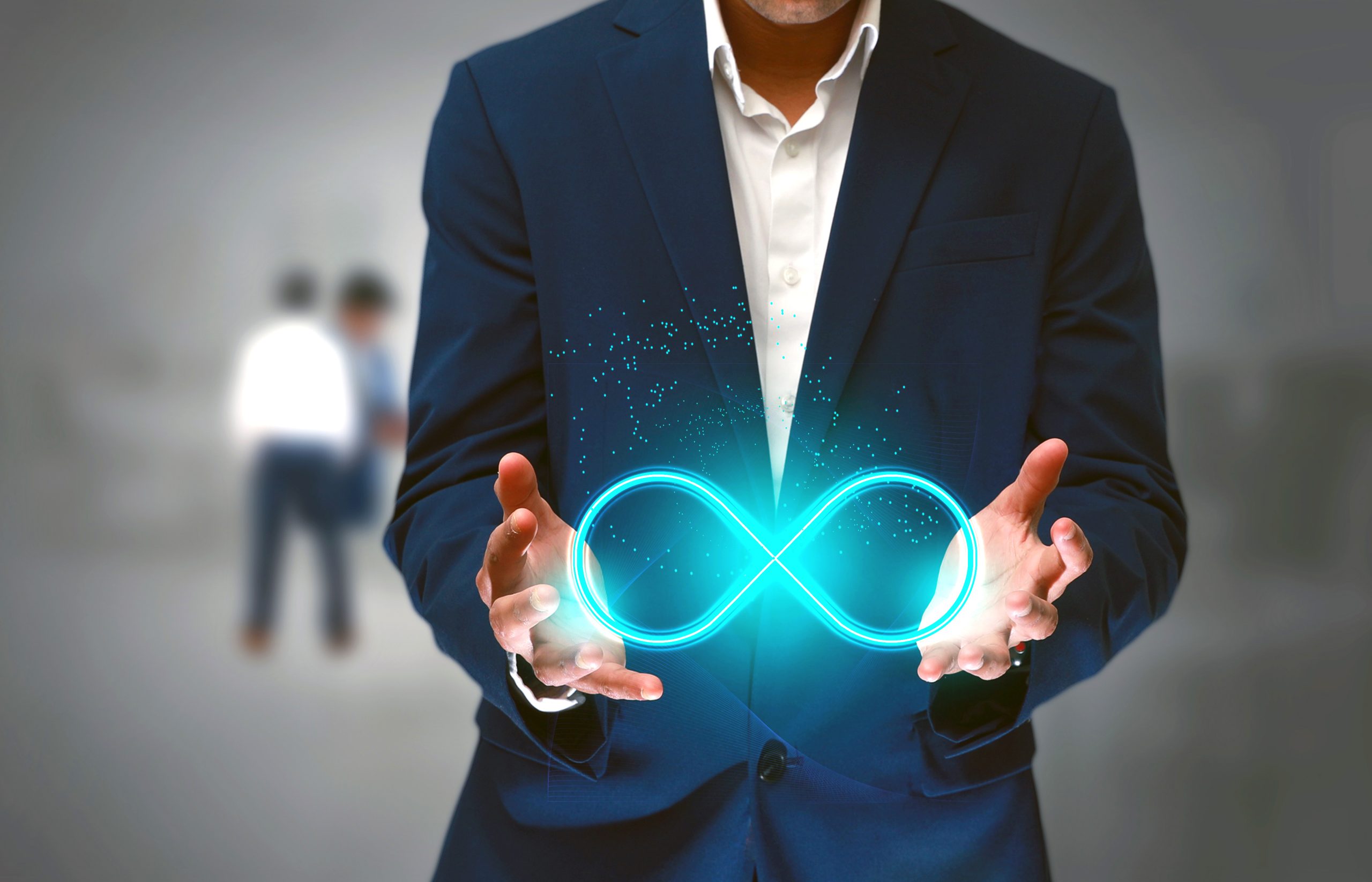 DevOps concept, an IT engineer holding the glowing devops symbol